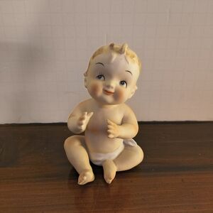 Adorable Porcelain Baby Figurine